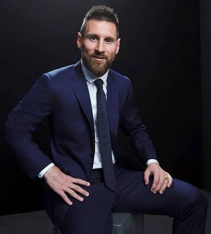 Lionel Messi wearing a suit.